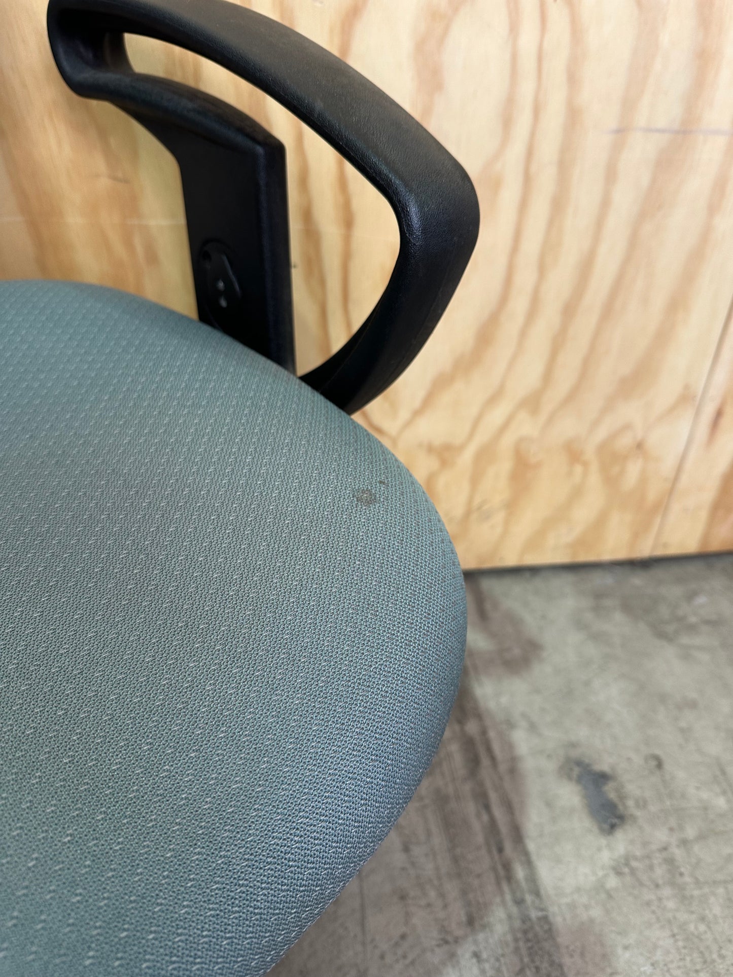 Green fabric covered office chair