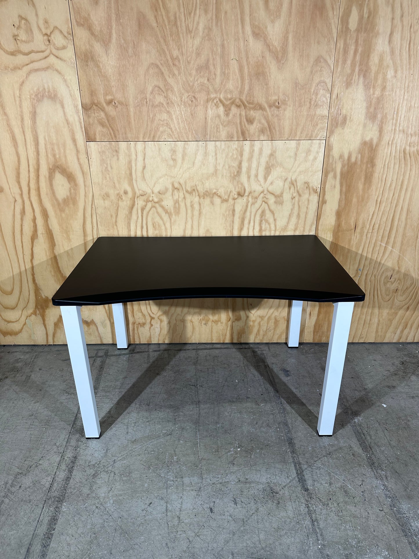 Black desk with curved edge