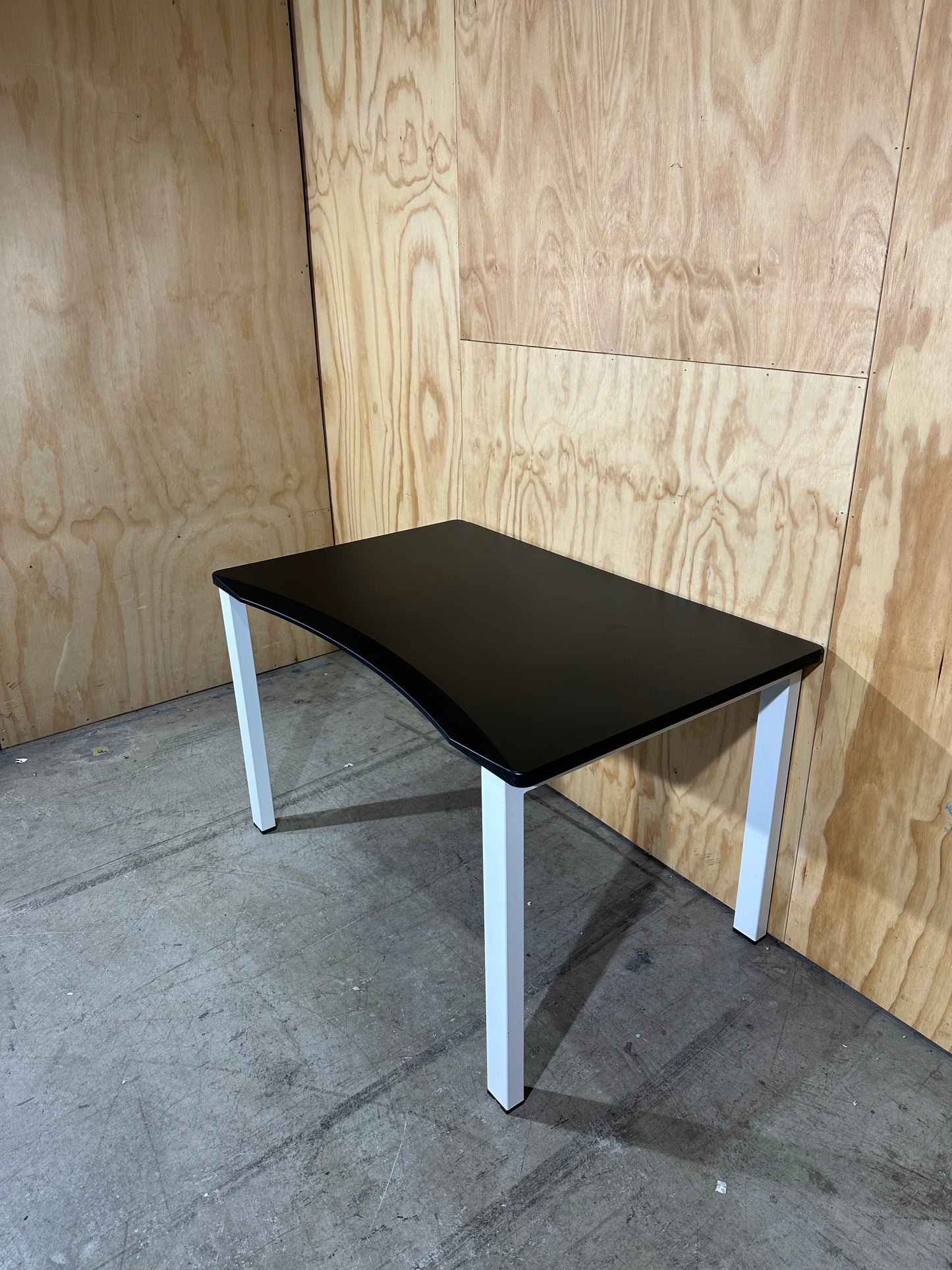Black desk with curved edge