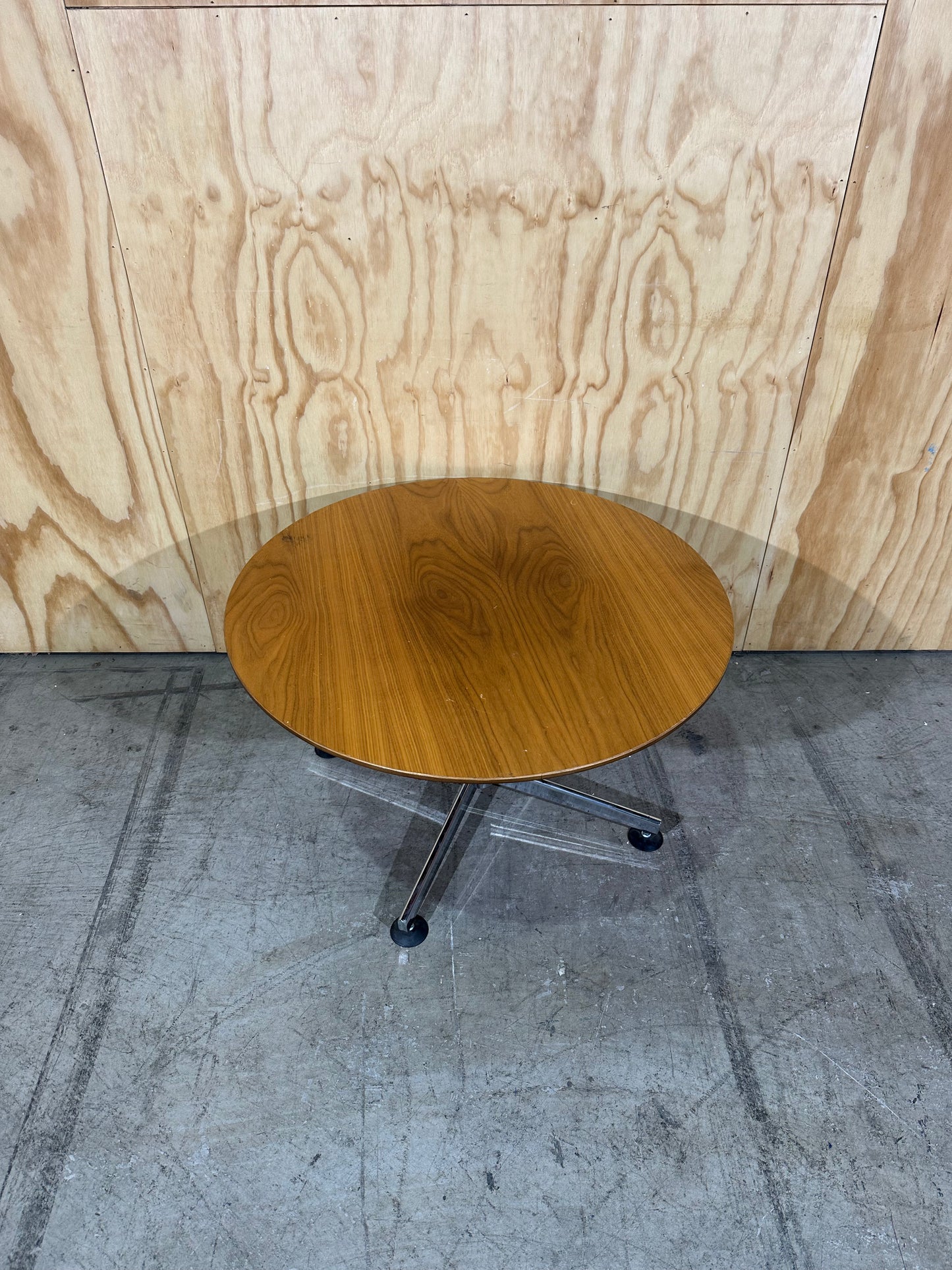 Round timber coffee table on chrome base