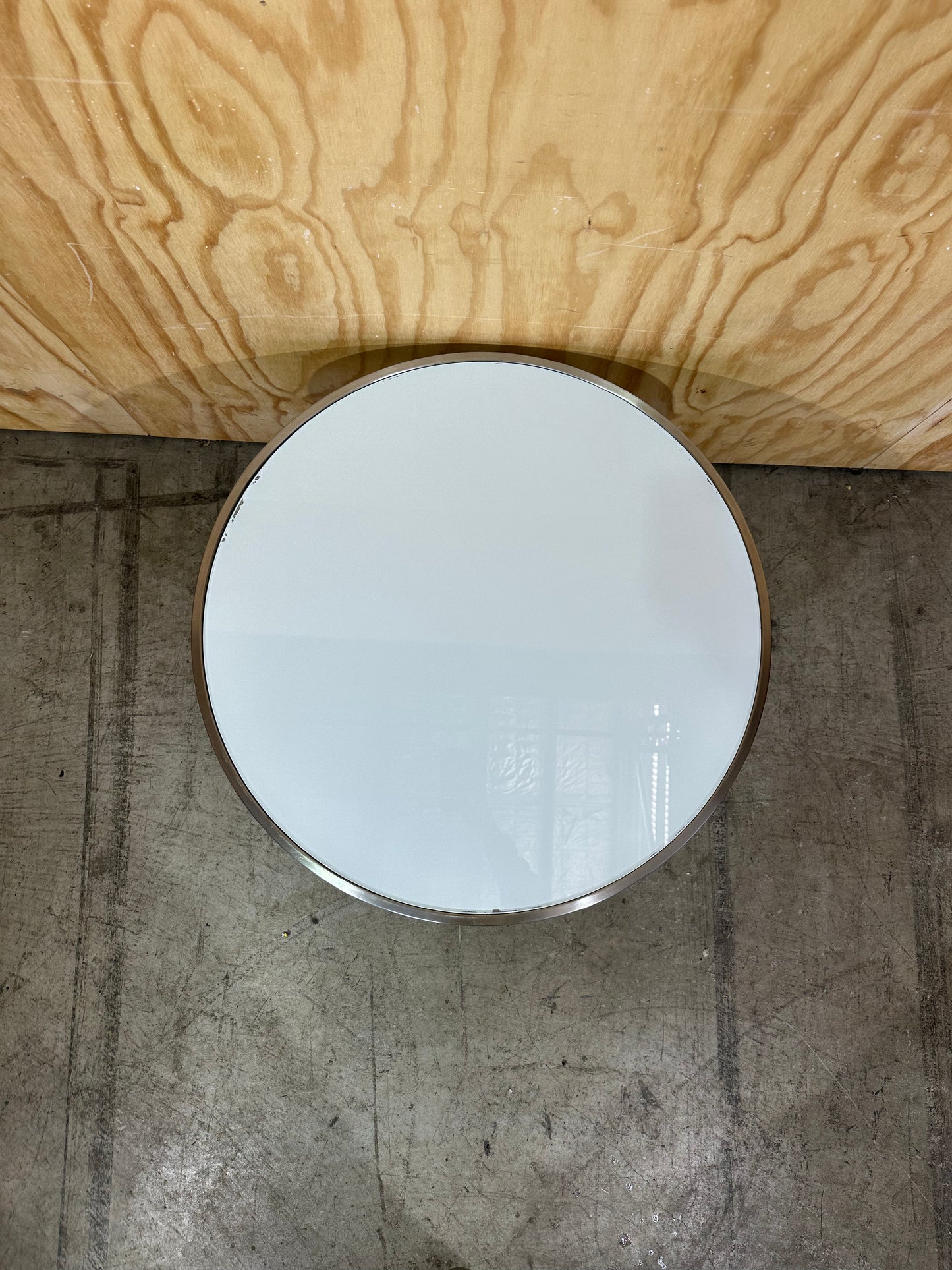 White glass coffee table on circular chrome base