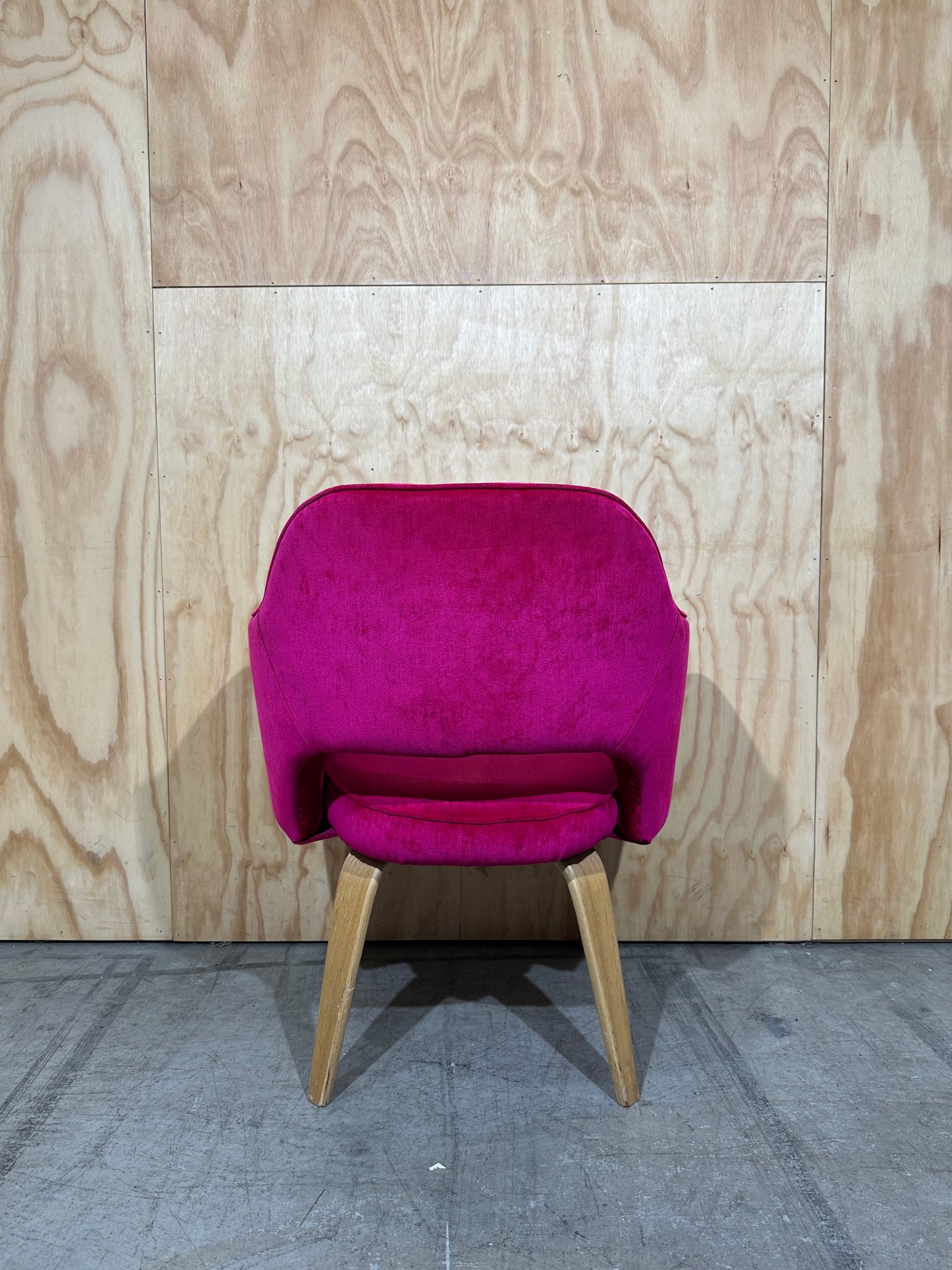 Hot pink velvet armchair on timber legs