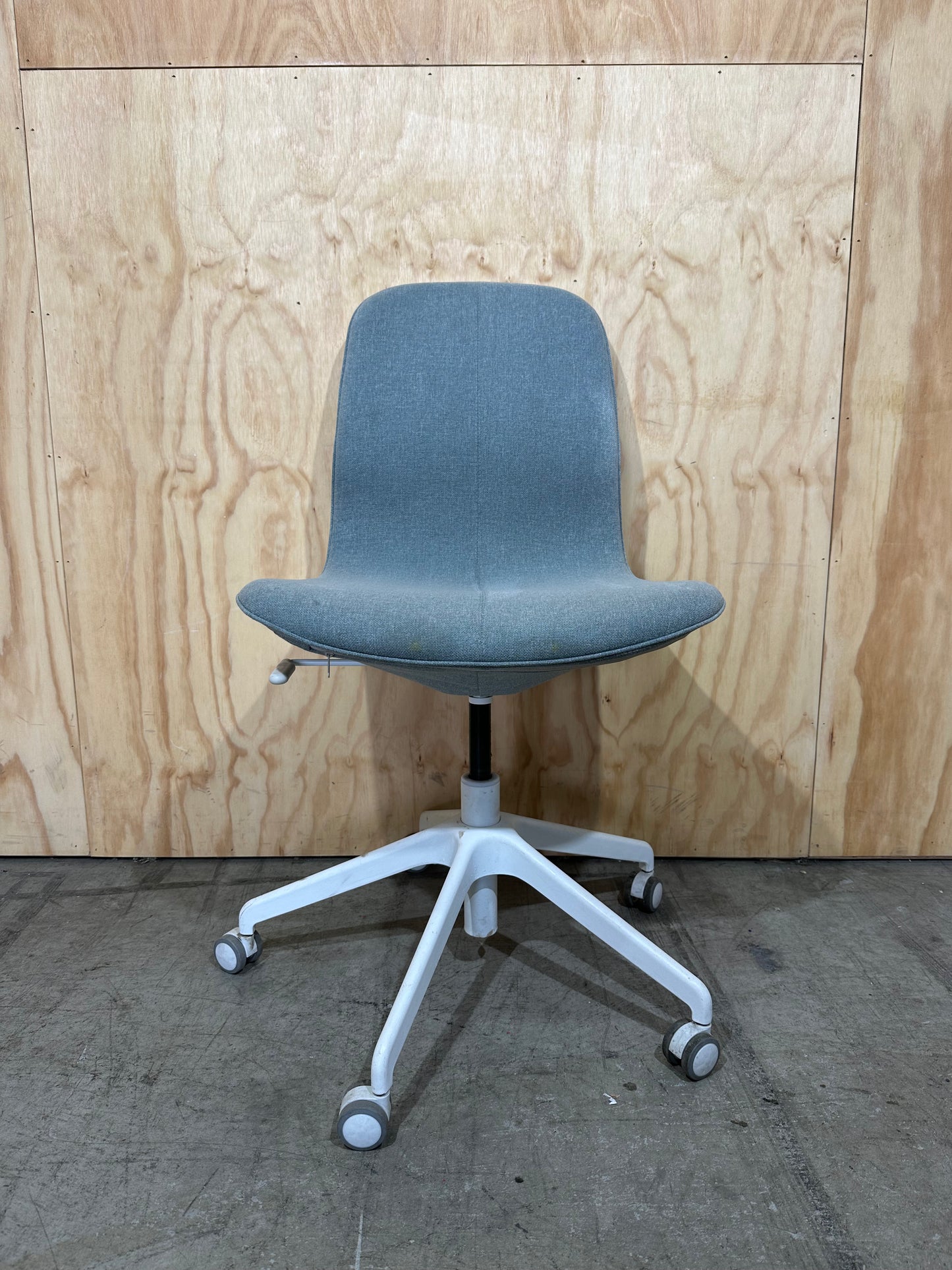 Light blue office swivel chair on castors