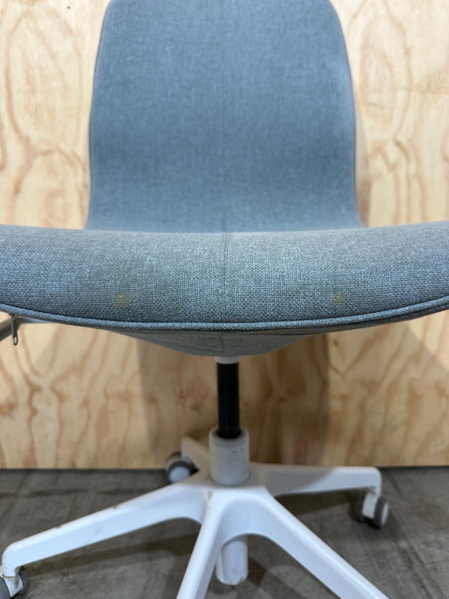 Light blue office swivel chair on castors