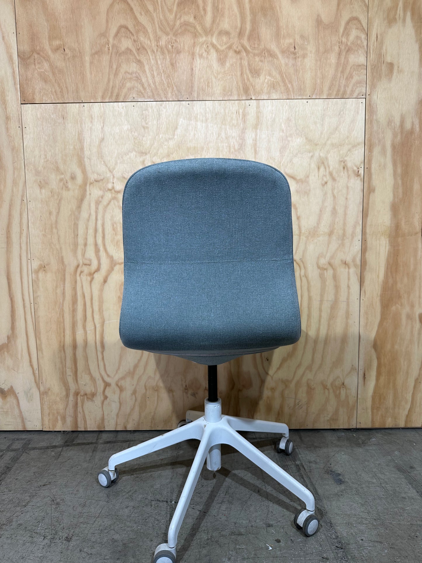 Light blue office swivel chair on castors