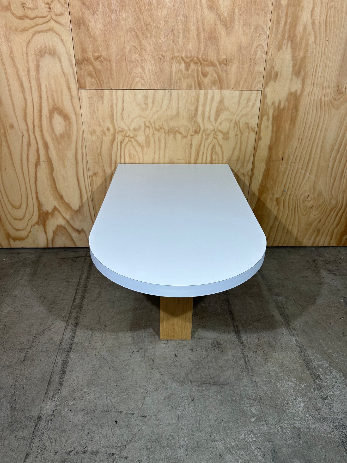 White wall mounted desk on timber legs & castors