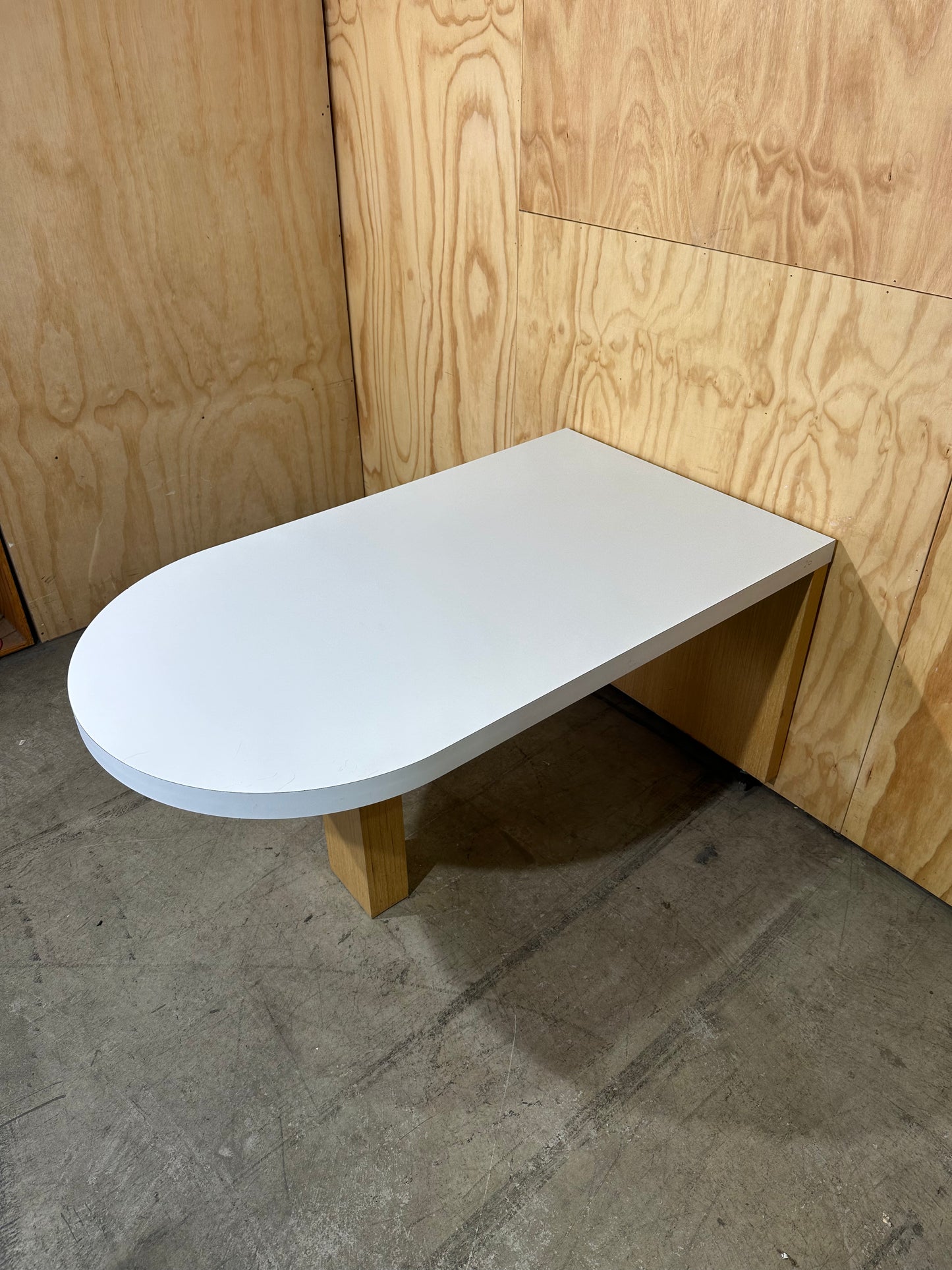 White wall mounted desk on timber legs & castors
