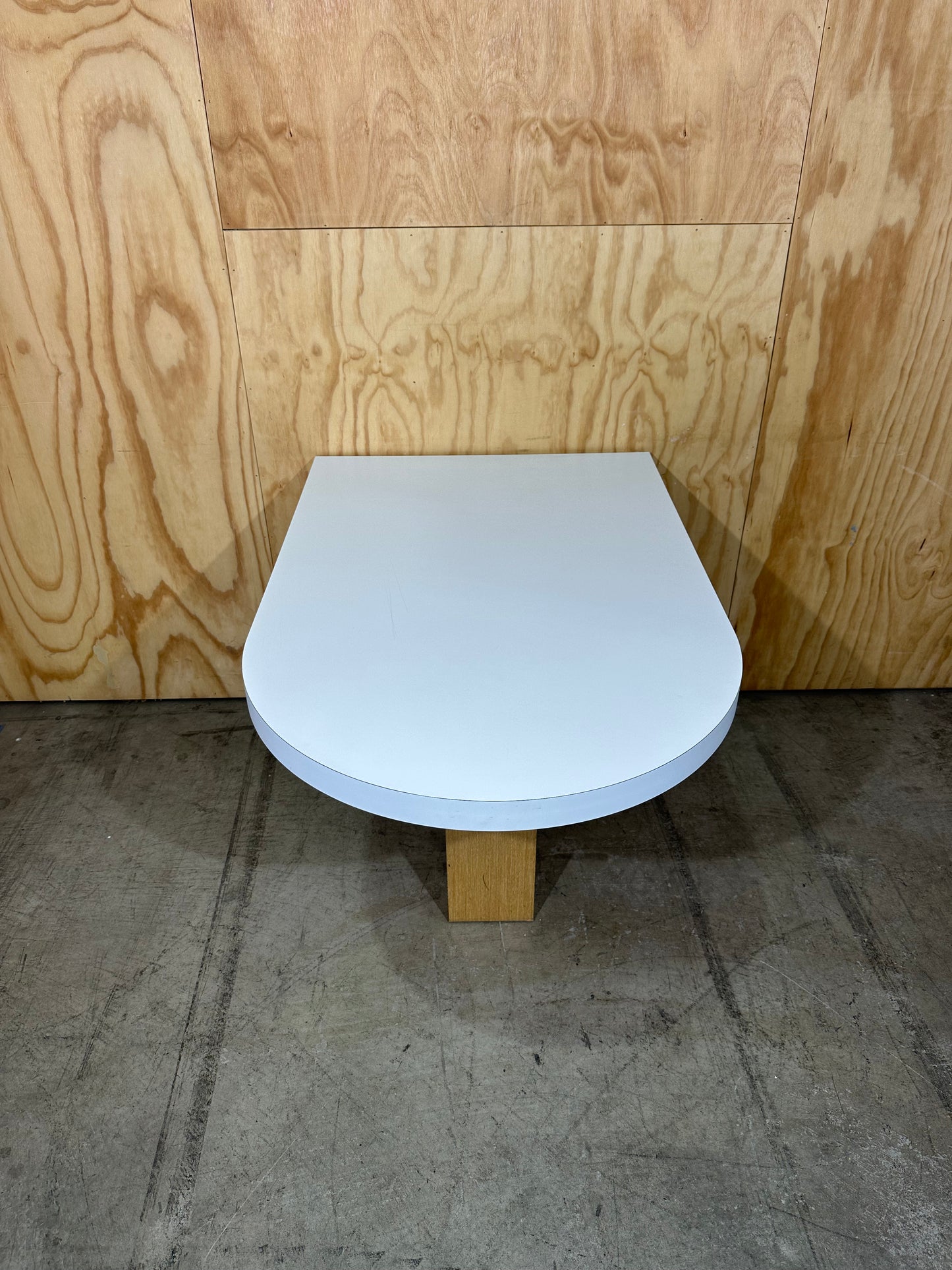 White wall mounted desk on timber legs & castors