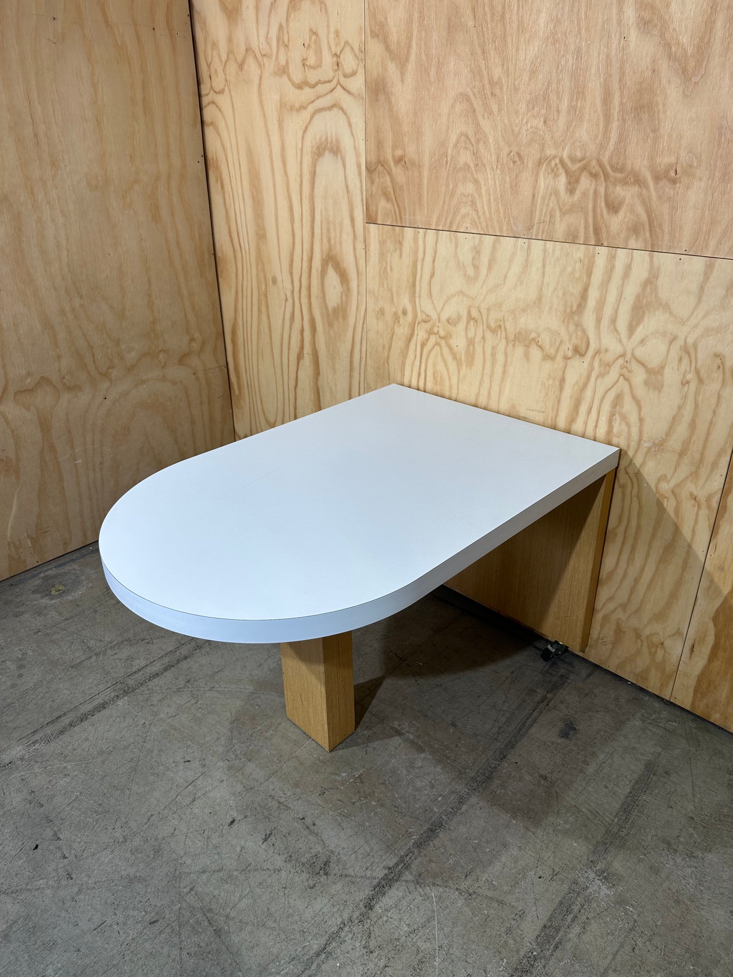 White wall mounted desk on timber legs & castors