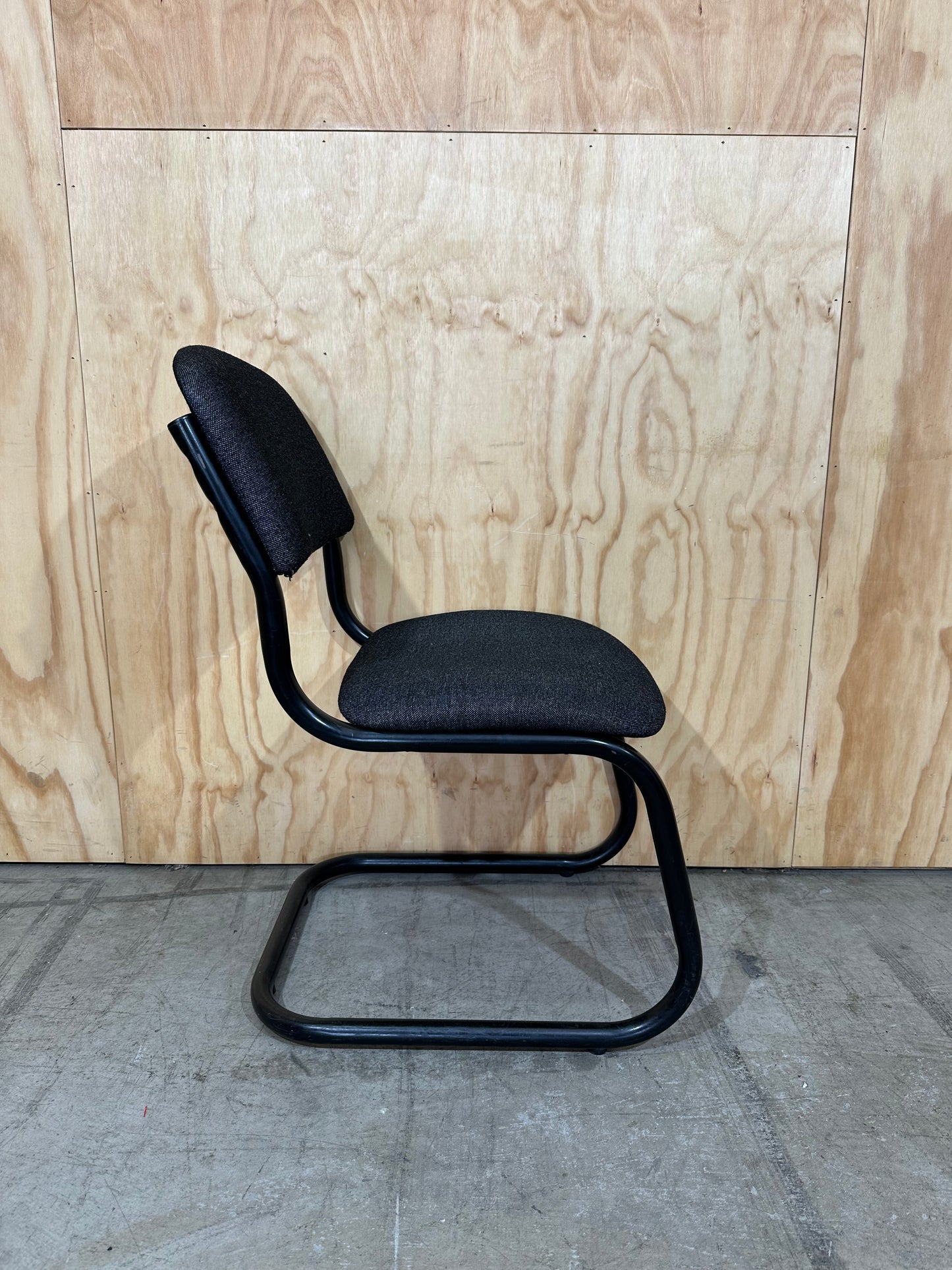 Upholstered grey cantilever chair