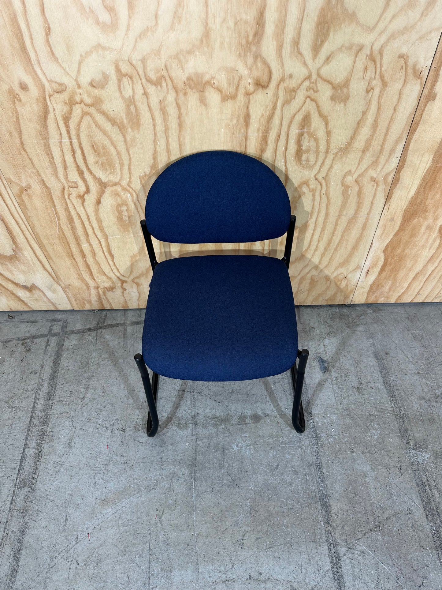 Upholstered blue visitor sled chair