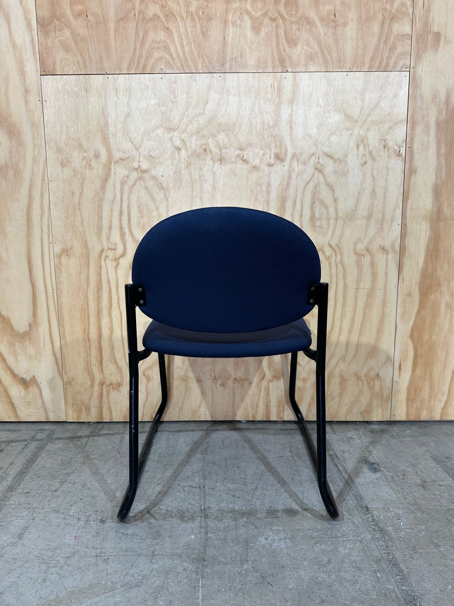 Upholstered blue visitor sled chair