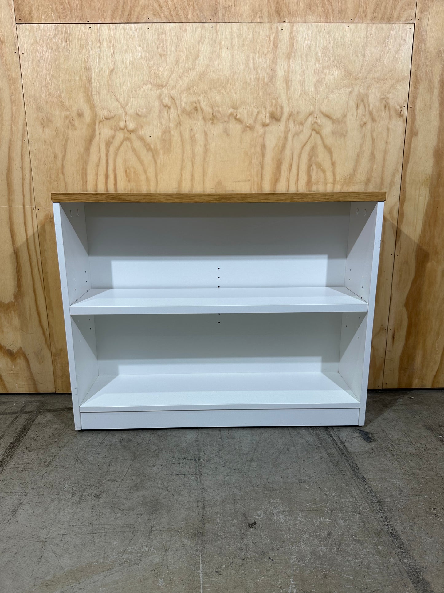 Wide white bookcase with timber top