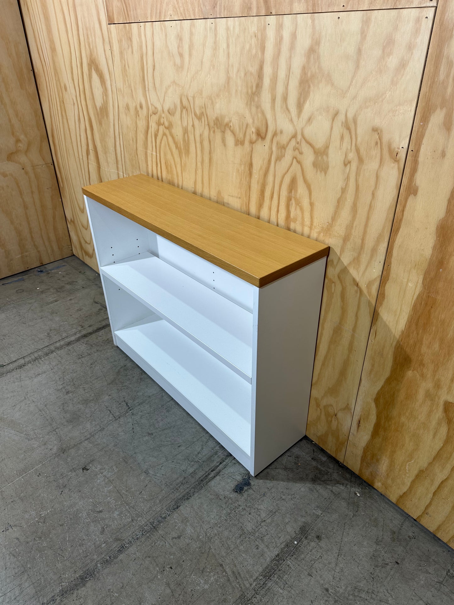 Wide white bookcase with timber top