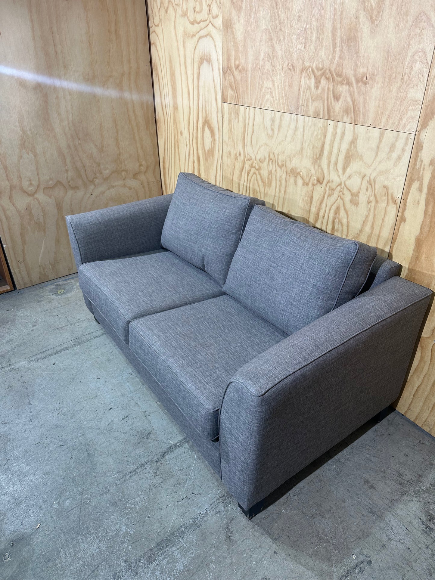 Grey 2 seater couch by Ridge Furniture