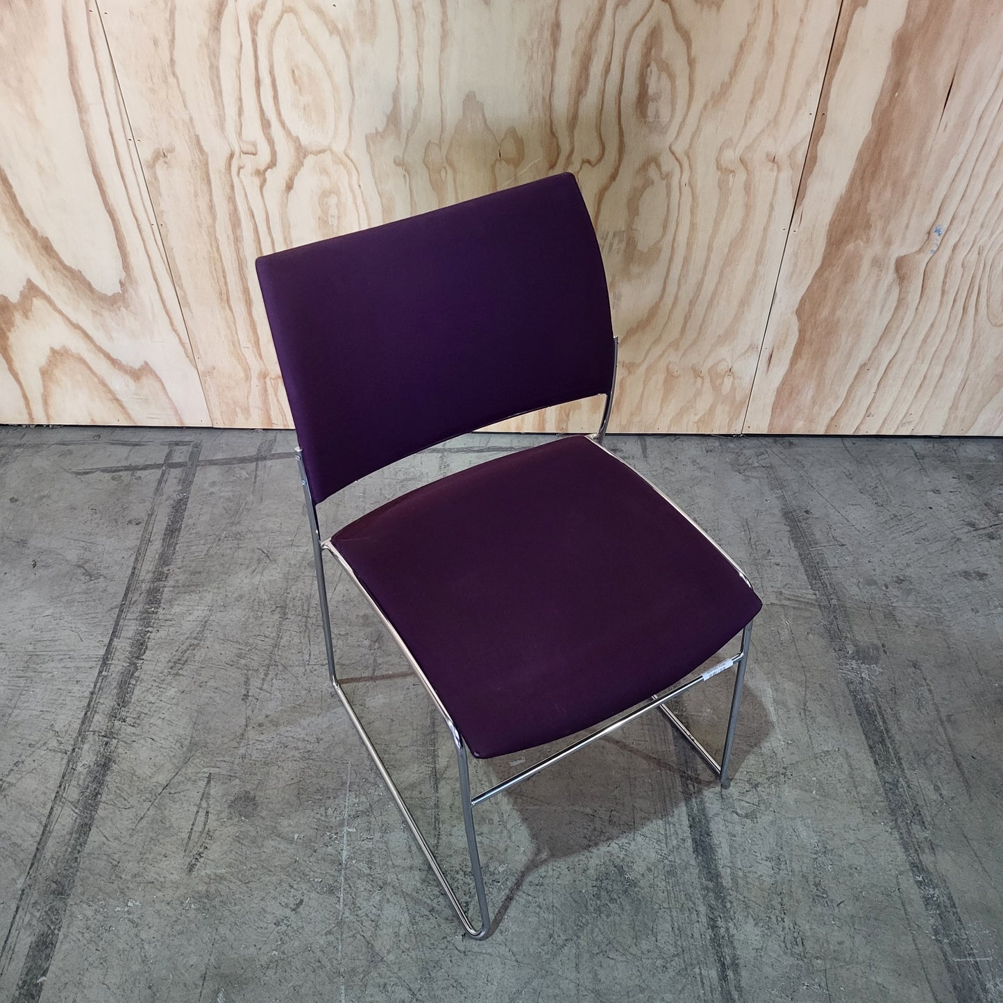 Stack of 26 Sled based visitor chairs with steel base on trolley