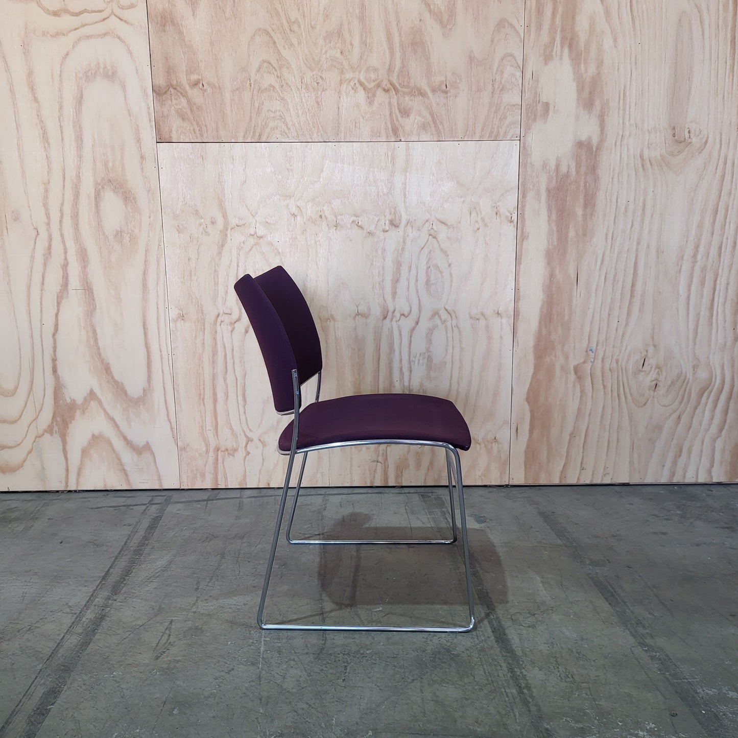 Stack of 26 Sled based visitor chairs with steel base on trolley