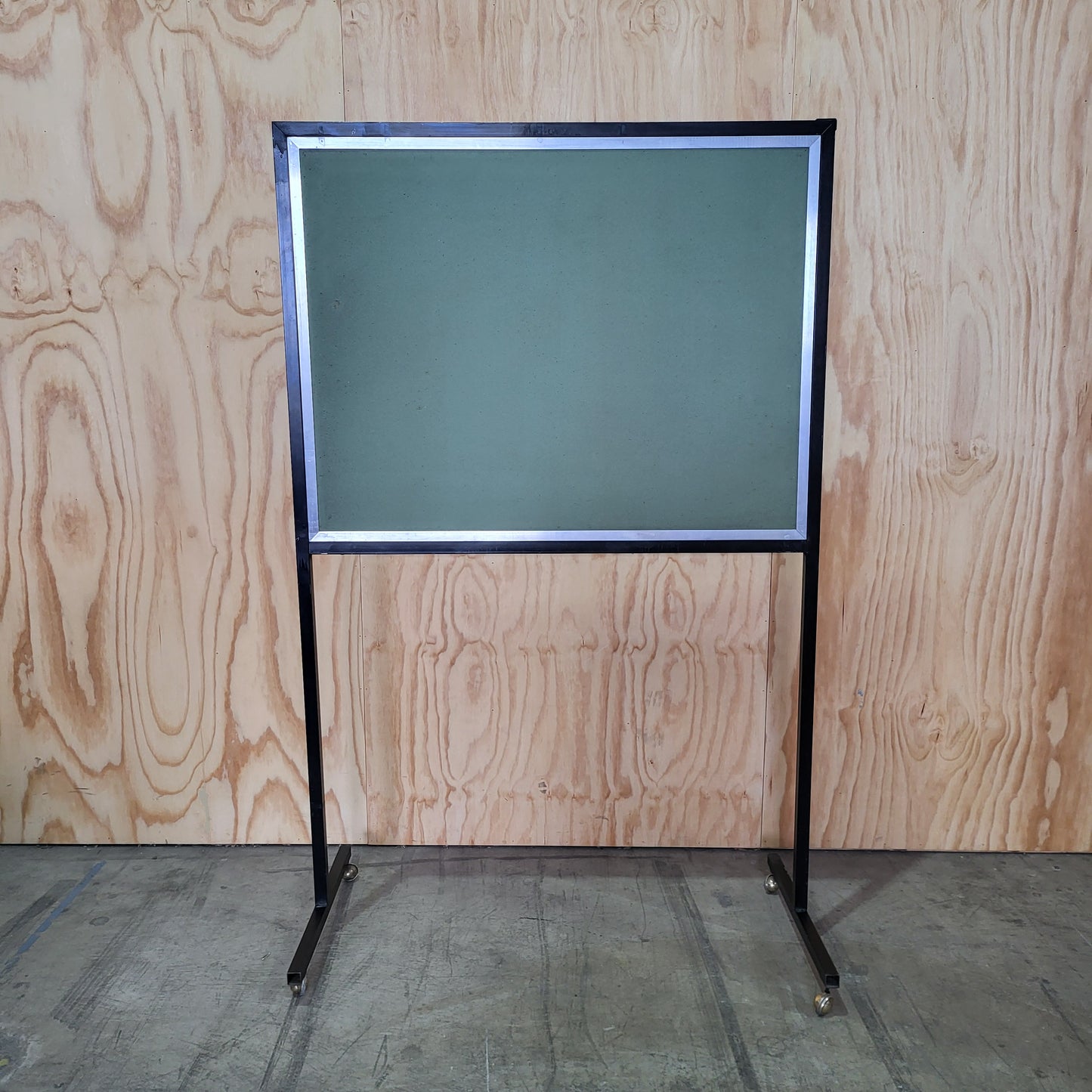 Green notice board on wheels