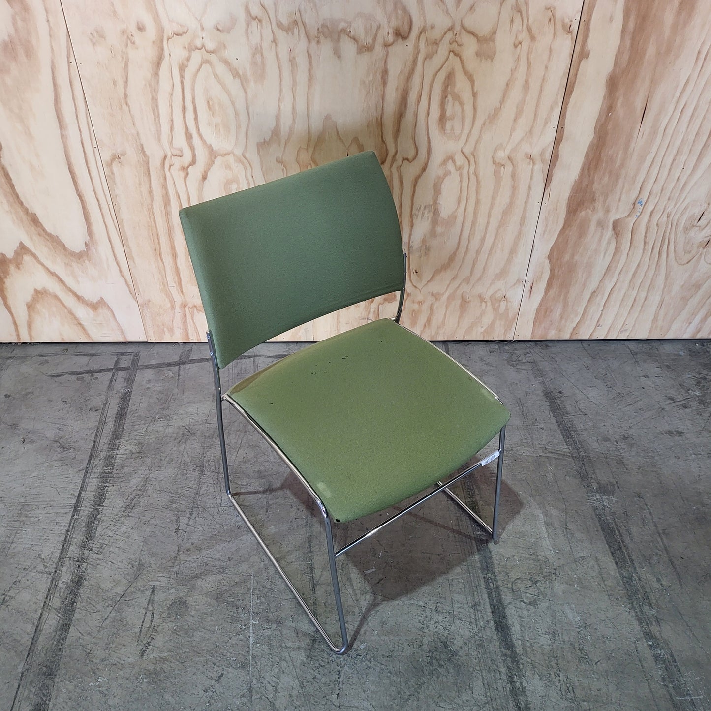 Stack of 26 Sled based visitor chairs with steel base on trolley