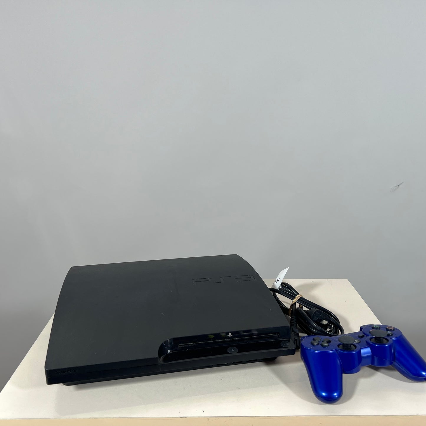 Sony PlayStation 3 Slim 300 GB with Official Sony DualShock 3 Blue Controller