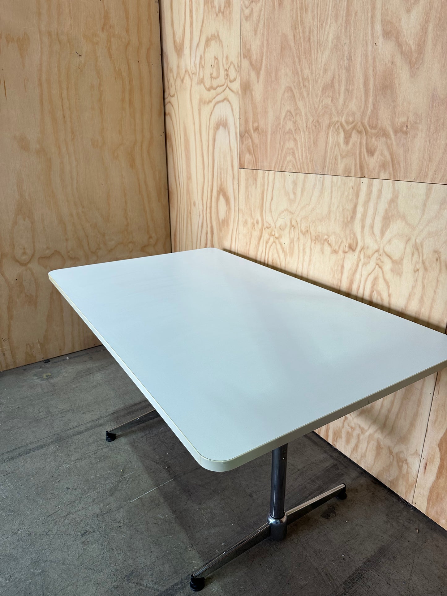 White table on chrome leg base
