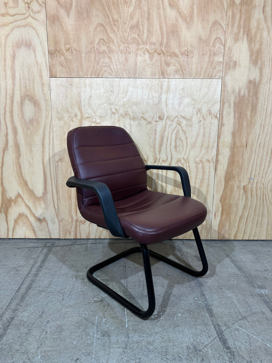Maroon leather boardroom sled chair with arms