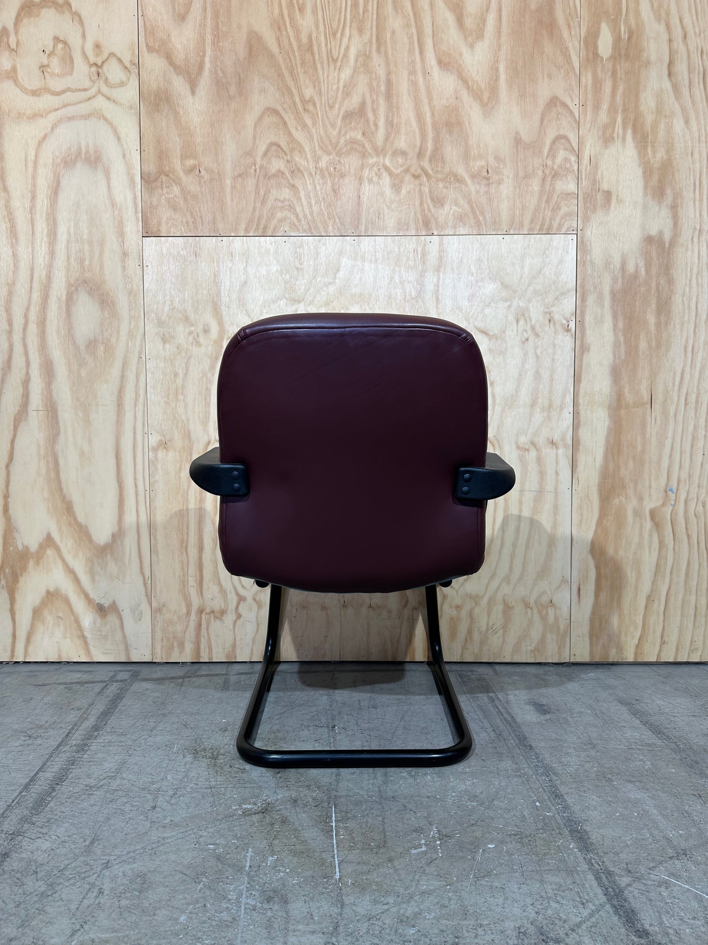 Maroon leather boardroom sled chair with arms