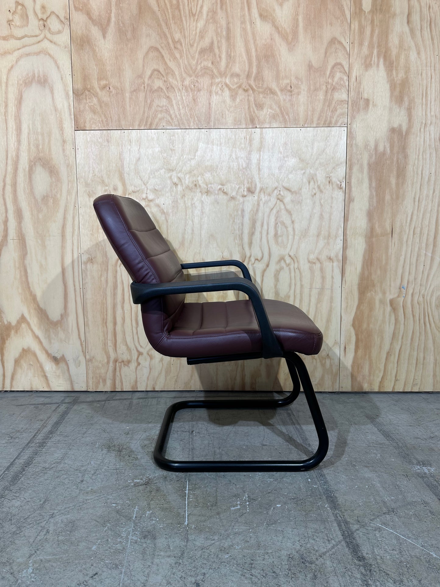 Maroon leather boardroom sled chair with arms