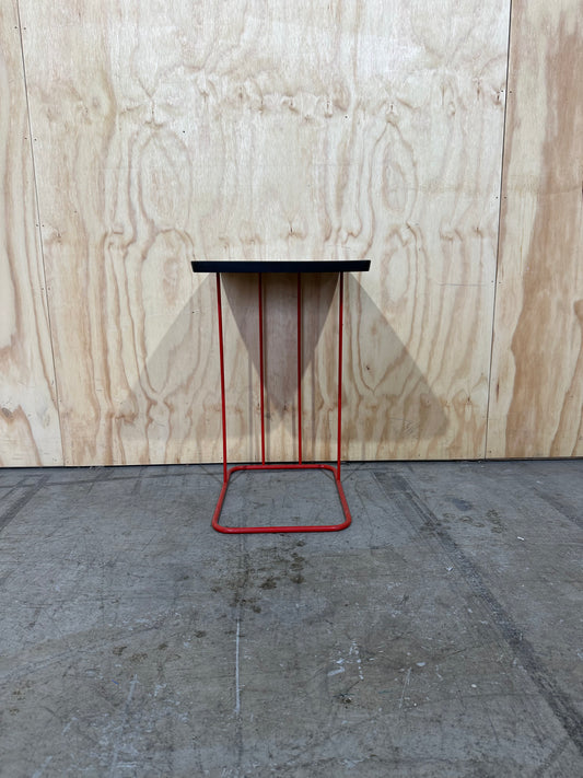 Wood magazine table with red metal base