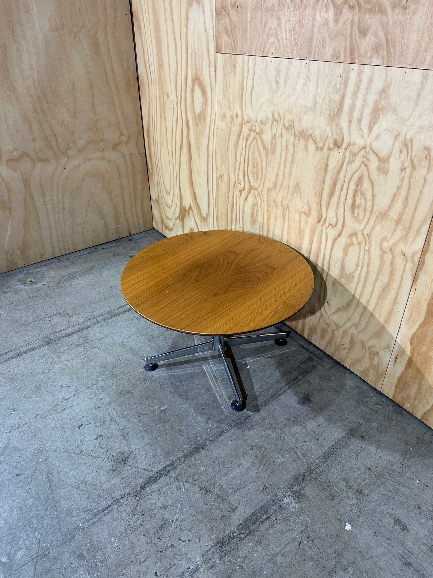 Round timber coffee table on chrome base