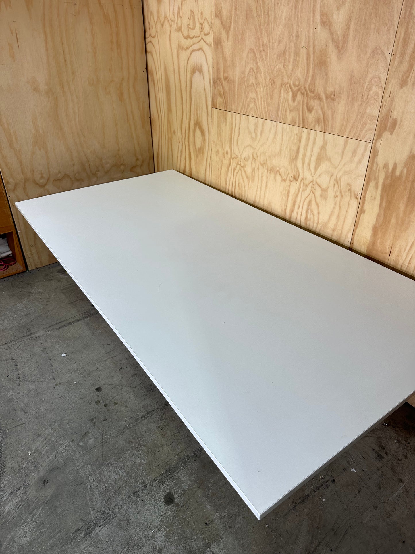 White boardroom table on Eames base