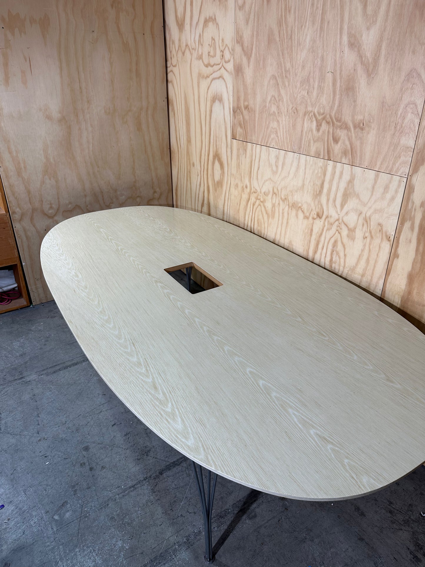 Boardroom table in beech veneer with Eiffel tower legs