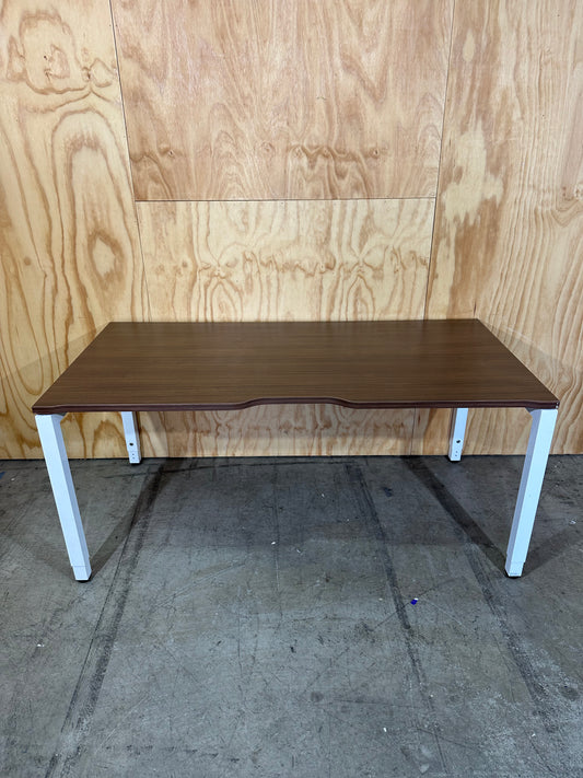 Dark wood veneer desk with white legs