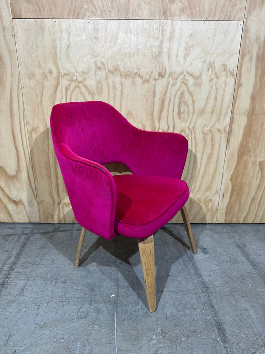 Hot pink velvet armchair on timber legs