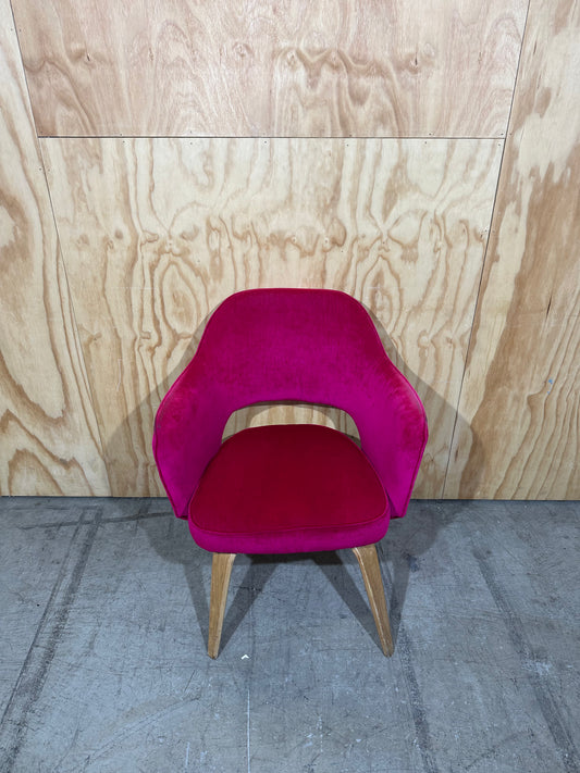 Hot pink velvet armchair on timber legs