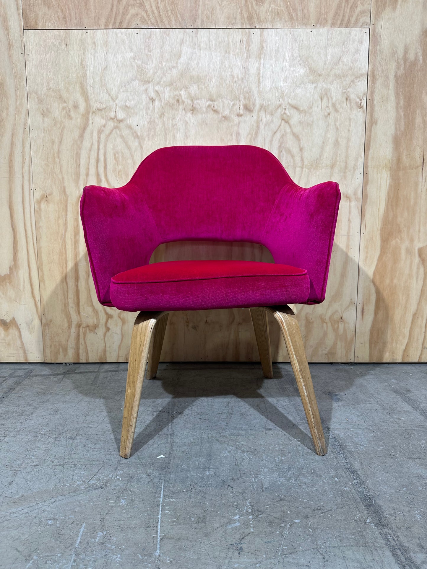 Hot pink velvet armchair on timber legs
