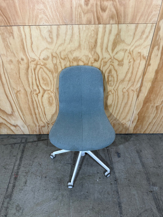 Light blue office swivel chair on castors