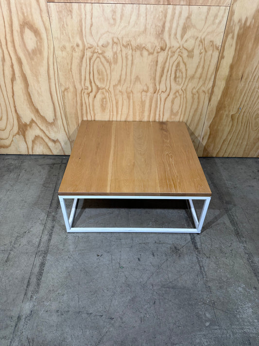 Square coffee table on white metal frame