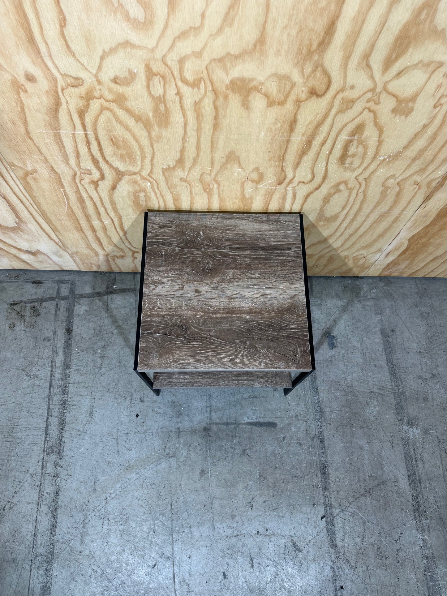 Timber laminate coffee table on black metal frame