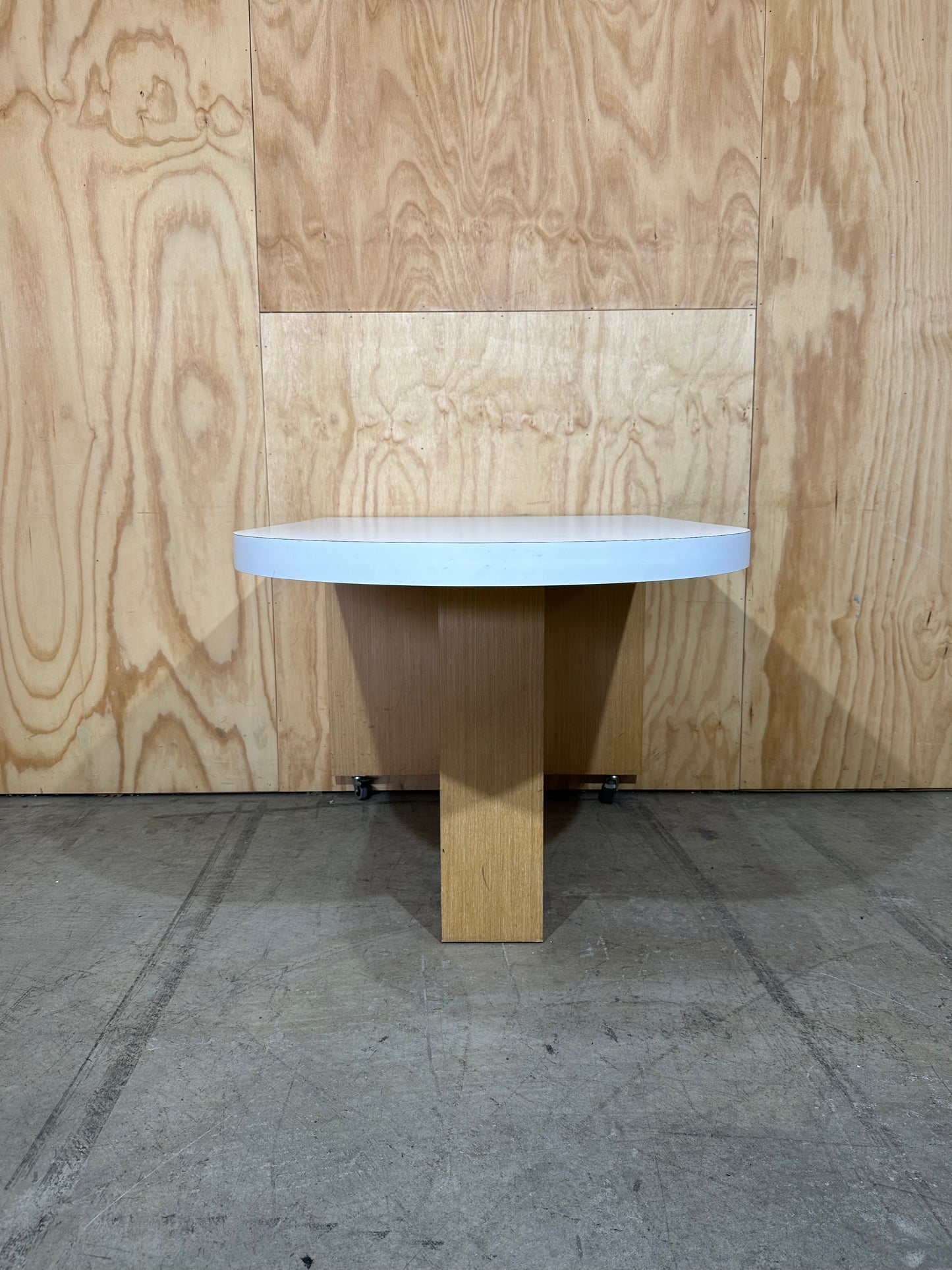 White wall mounted desk on timber legs & castors