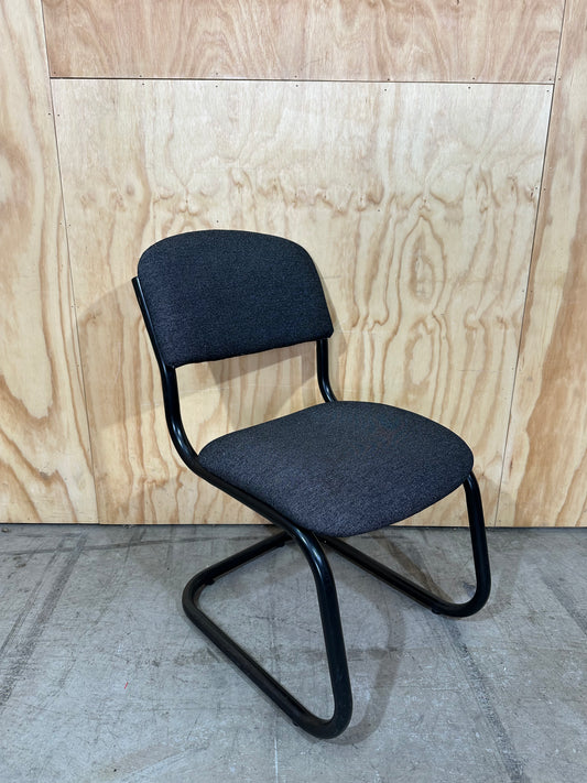 Upholstered grey cantilever chair