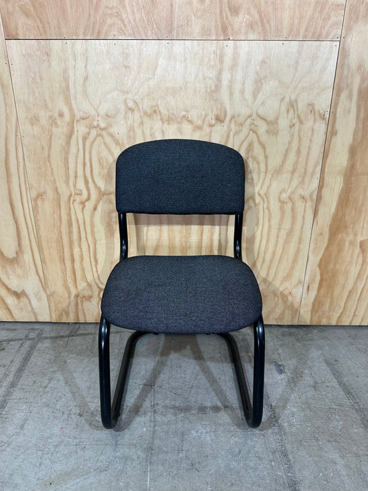 Upholstered grey cantilever chair