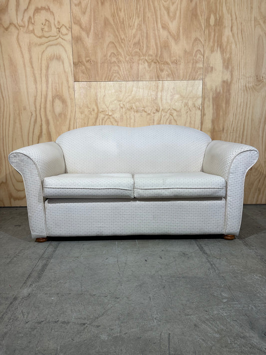 White couch with pattern