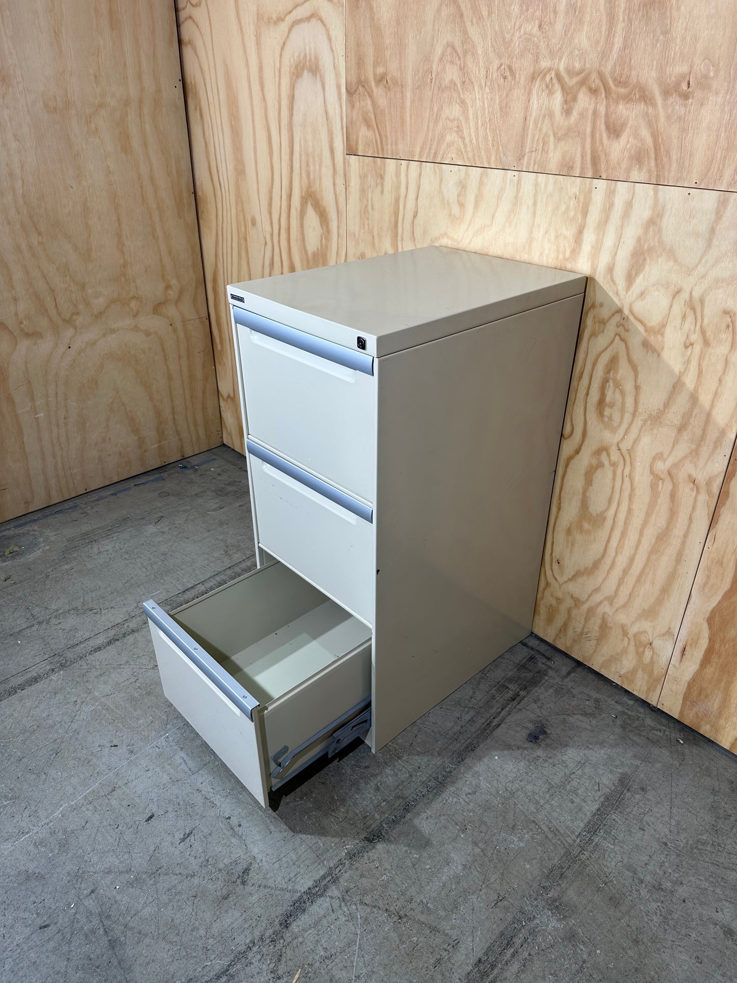 Three drawer filing cabinet in beige