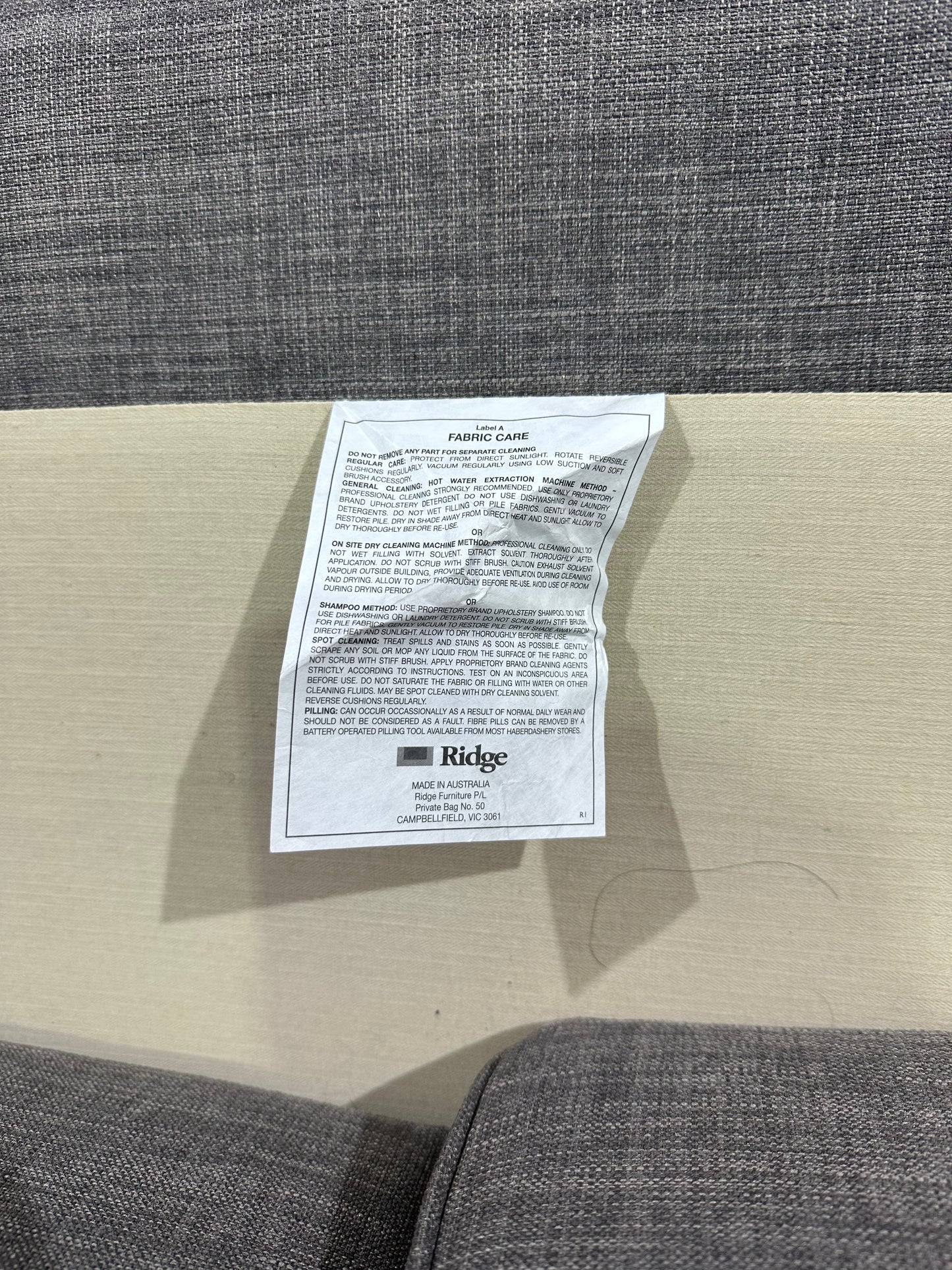 Grey 2 seater couch by Ridge Furniture