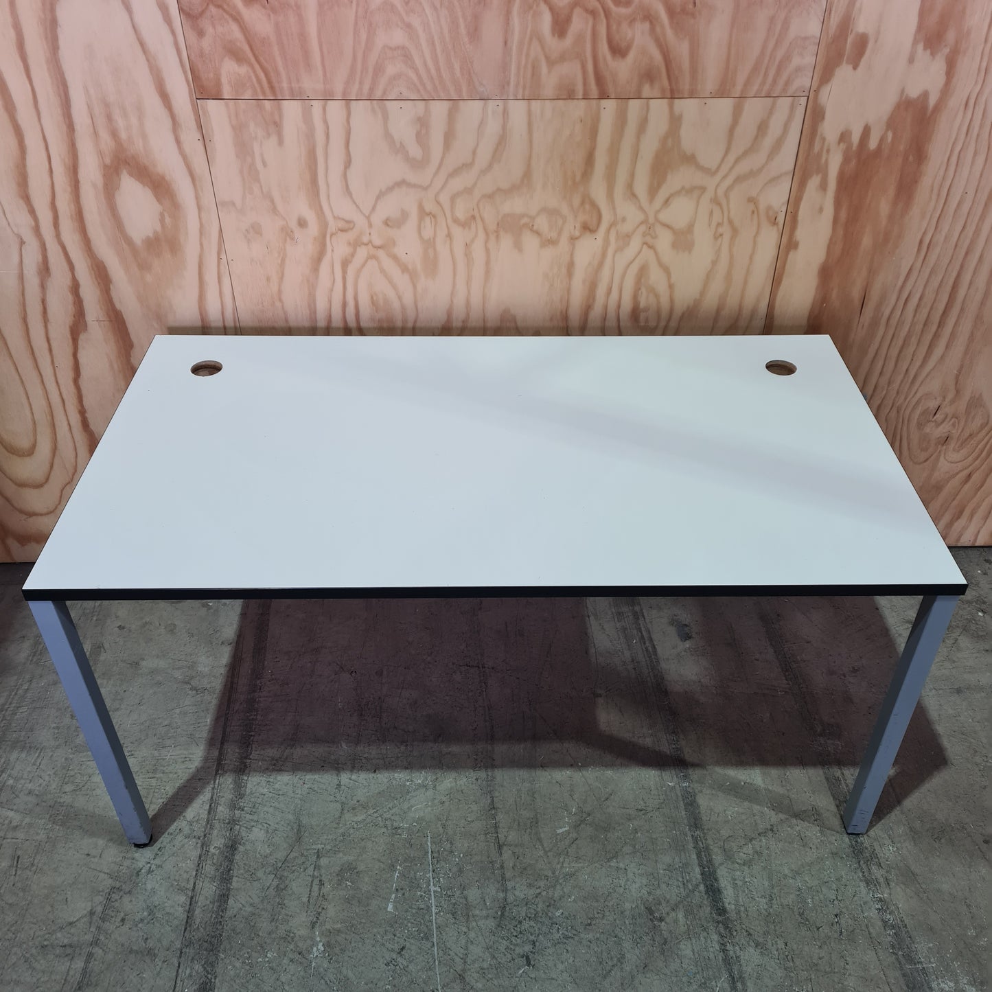 White meeting room table on metal legs